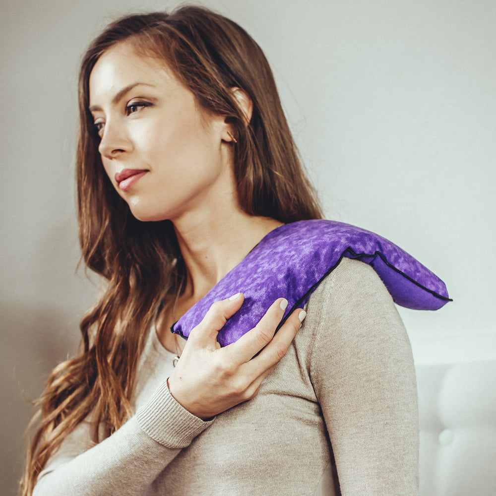 MyCare General Heating Pad purple shown on shoulder