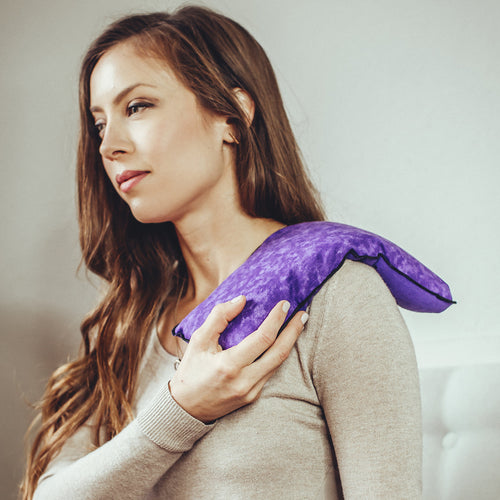 MyCare General Heating Pad purple shown on shoulder